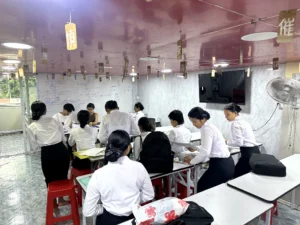 Kanji Masters Academy founder with students in the Branch 3 classroom